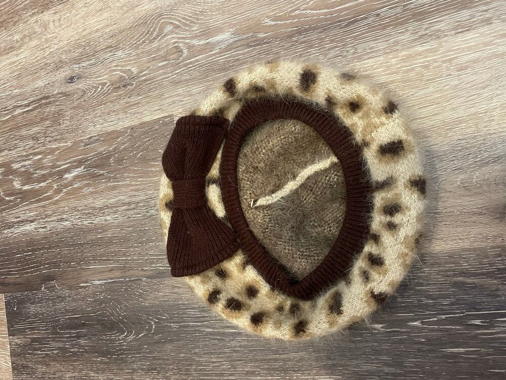 cheetah with a bow beret